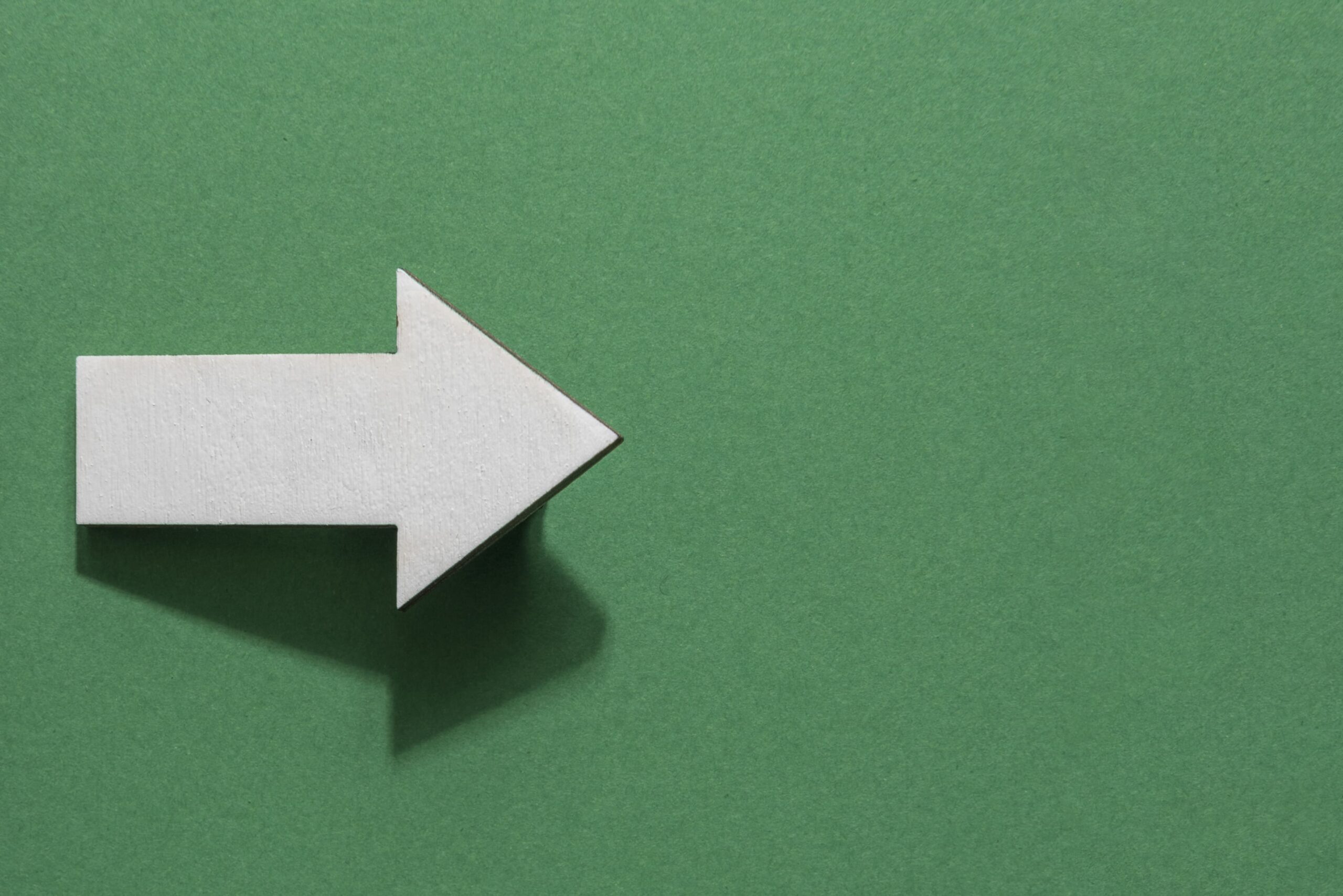 top-view-white-arrow-with-copy-space (1) (1)